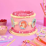 Disney Princess Cake by Crumbs & Doilies with edible images of Ariel, floral frosting, perfect for birthday celebrations.